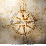stock-photo-old-compass-on-paper-background-121259659